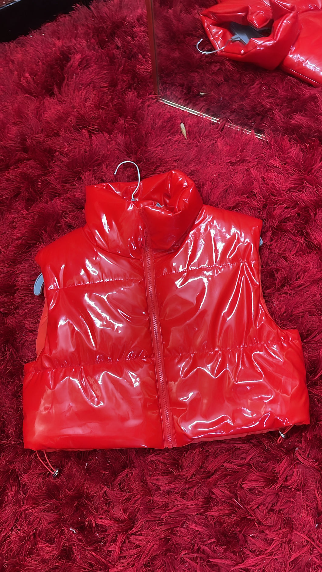 red puffer vest